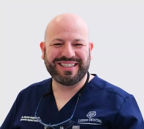 Dr. Hassan Maghaireh, cosmetic and implant dentist at Leeds Dental Clinic, smiling.