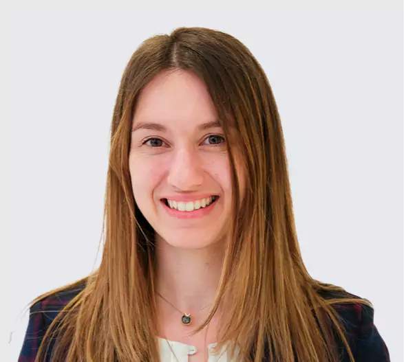 Smiling female professional at Leeds Dental Clinic.